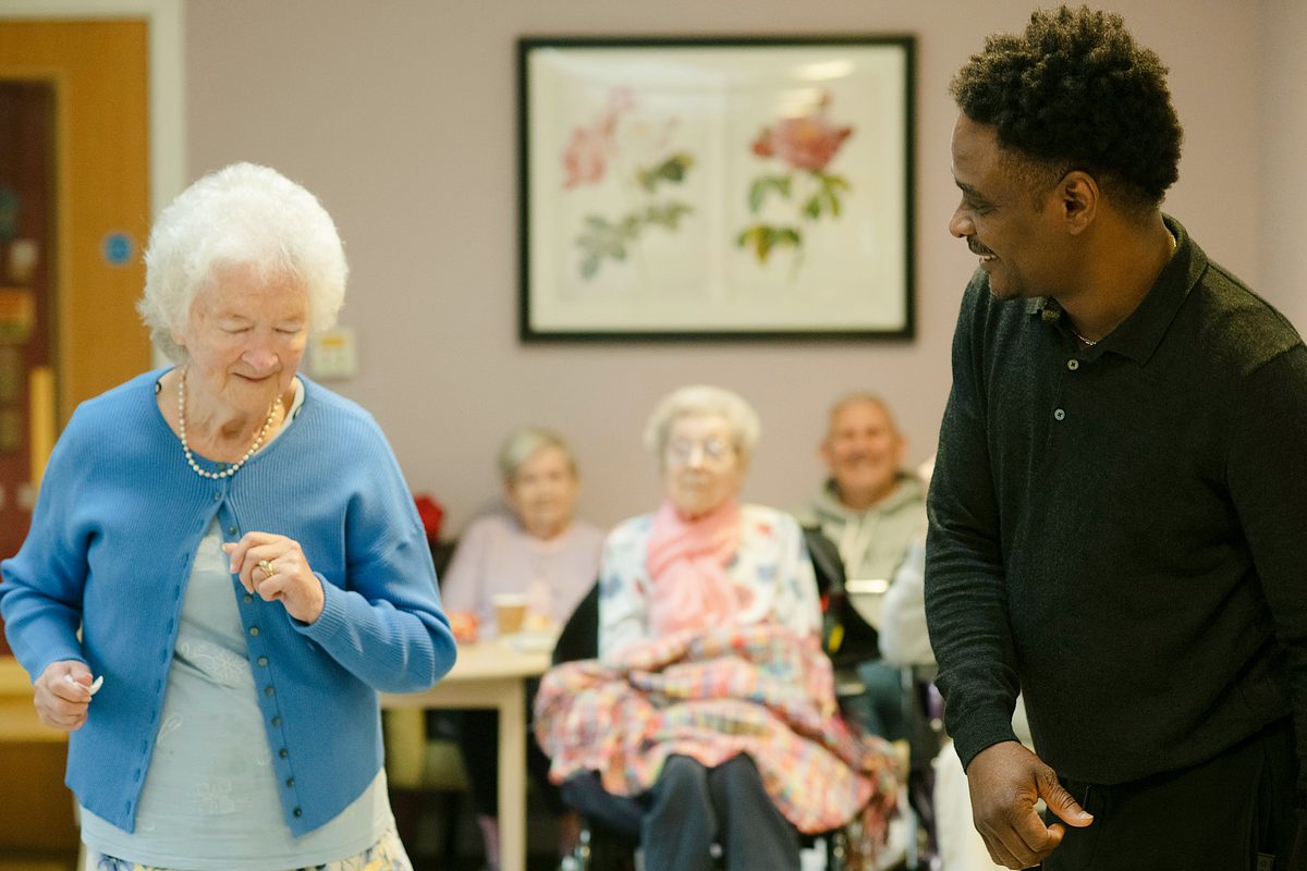Patient celebrating recovery at home with Texas Therapy Pros